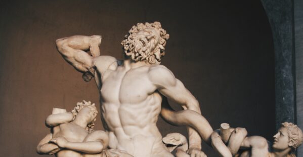 The statue of Laocoön and His Sons, Vatican - a Hellenistic Greek sculpture of a man and his two sons being attacked by snakes. Photo by Iam_os via Unsplash.