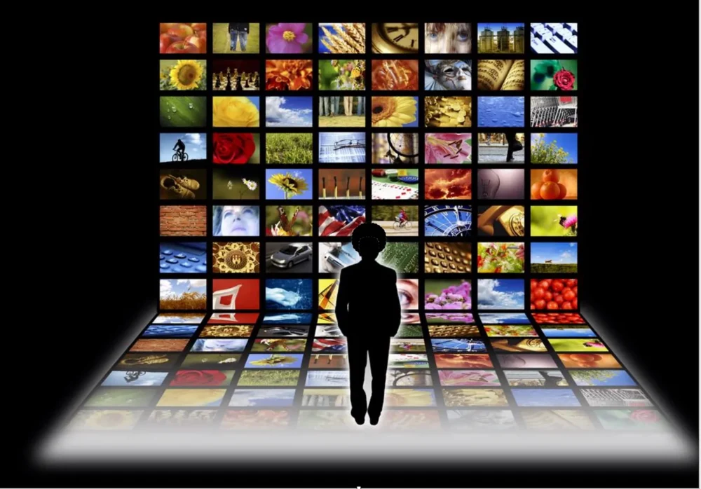 Illustration of a person's back as they look at various colorful imagery