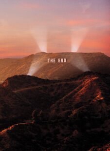 Illustration of a "The End" sign on hills with bright lights