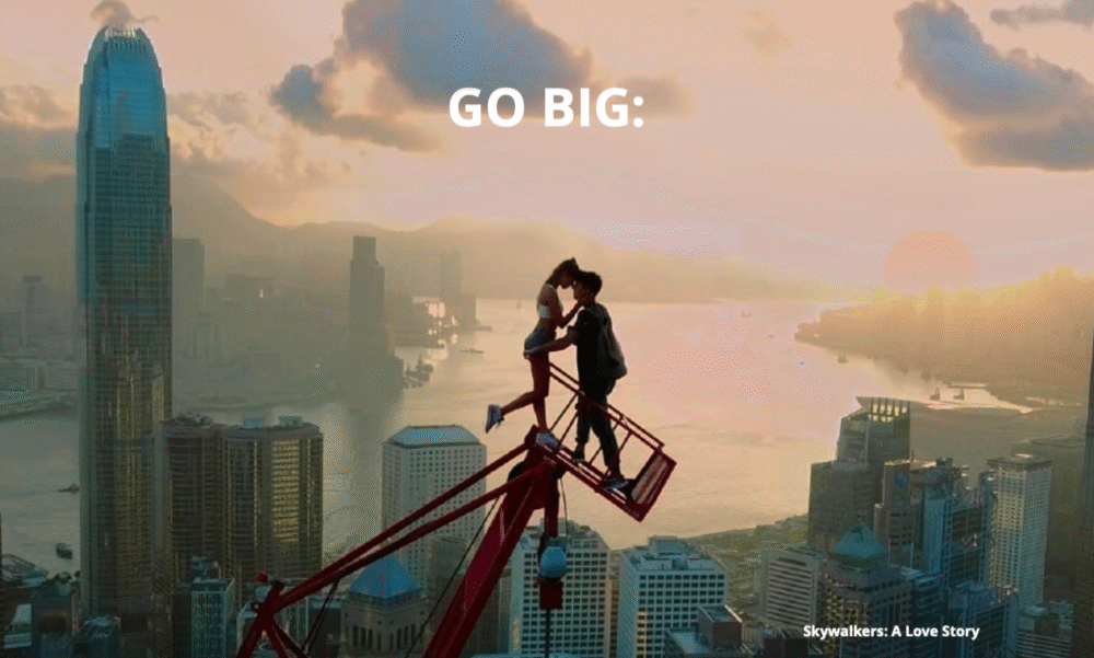 Photograph of two people standing on top of a crane in a city, a scene from 