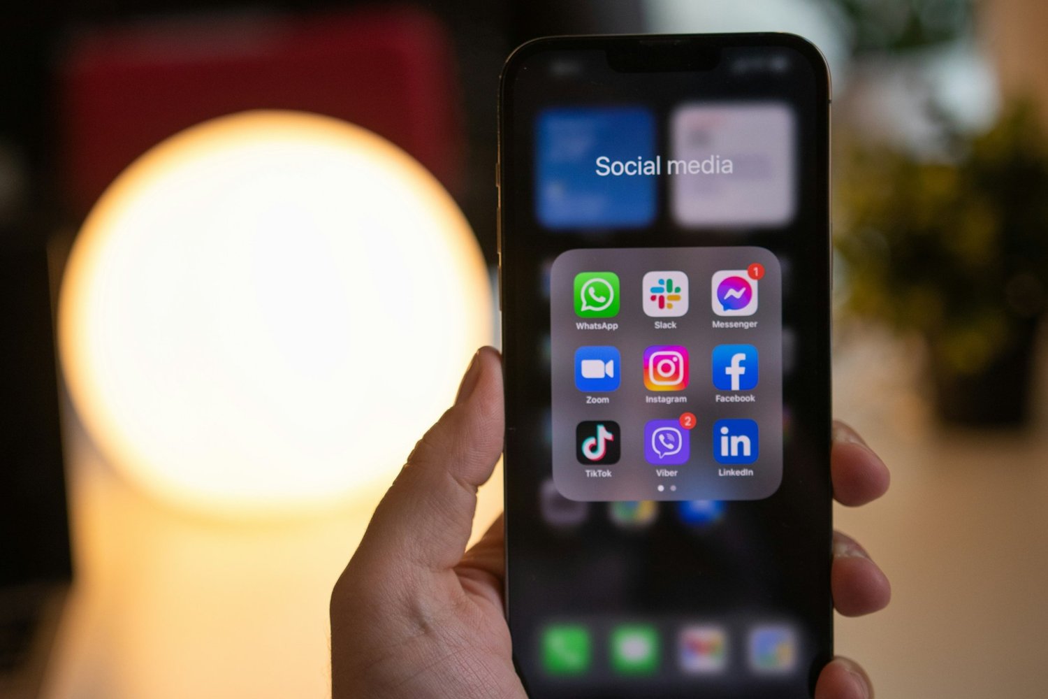 image of a phone showing icons for social media apps