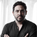 Bernardo Ruiz, a light skinned man with dark hair and close-cropped beard, wearing a dark colored button down shirt