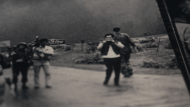 Individuals outdoors on a street captured through a photograph