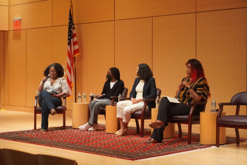 Brandi Collins-Dexter moderates a panel discussion at the Outbraving Summit 2024