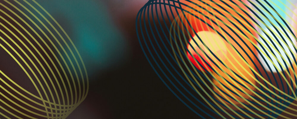abstract image of dots of light, suggesting cameras, tv lights, or a city