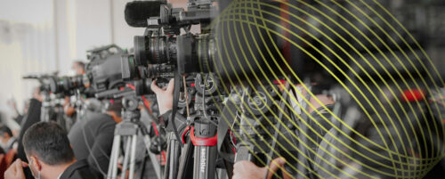 image of a line of press cameras