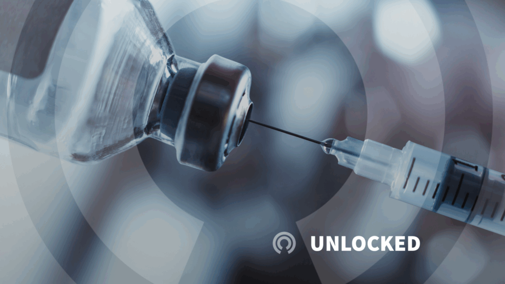 Medical syringe inserted into vaccine vile