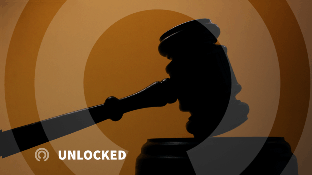 Gavel in shadows with dark orange gradient background, Unlocked series logo in lower left corner.