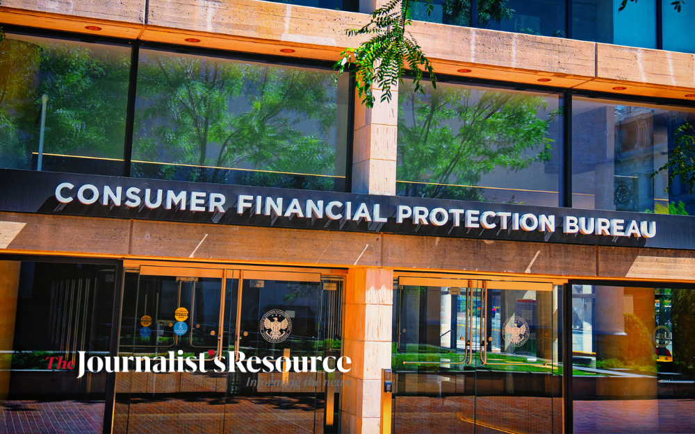 Alt text: Consumer Financial Protection Bureau building entrance with glass doors and tree reflections; “The Journalist’s Resource” watermark.
